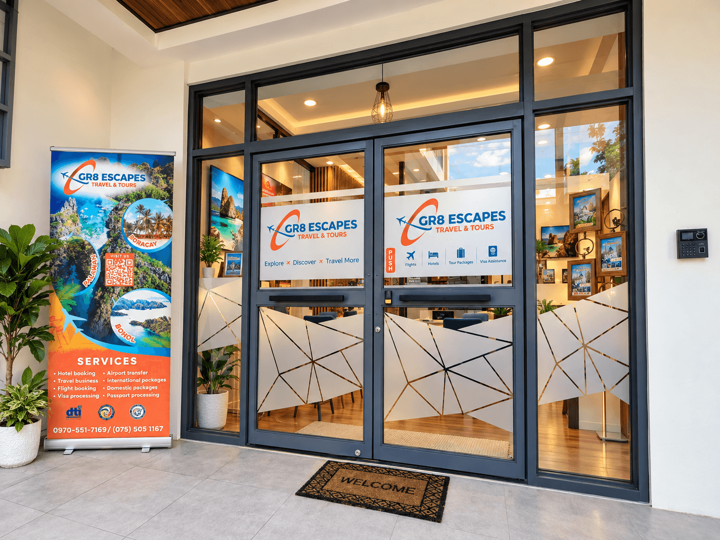 Glass entrance with GR8 Escapes Travel & Tours signage in Manaoag